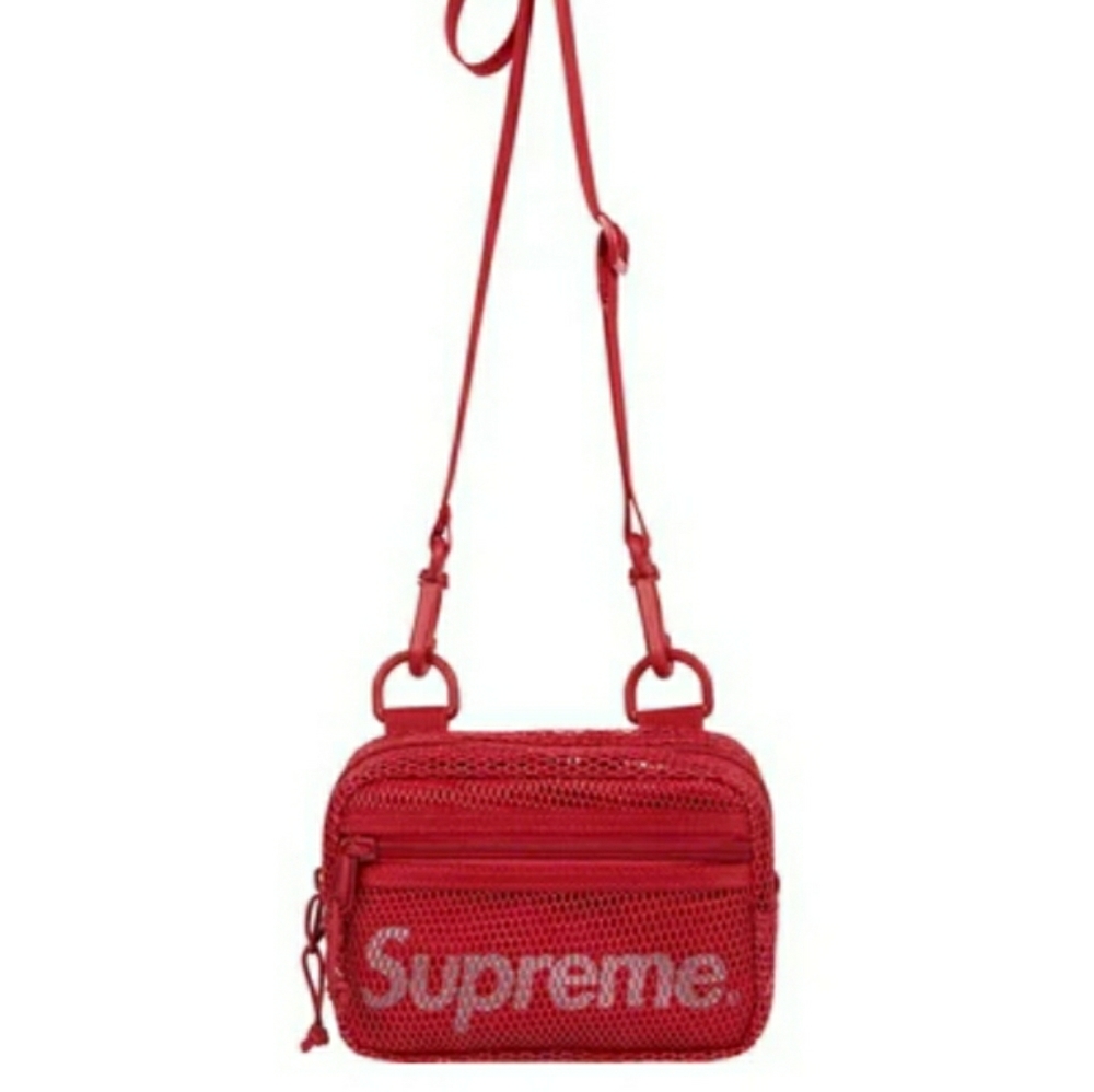 Supreme shoulder bag w/ rain pancho. Unisex